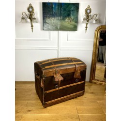 Old domed trunk covered with leather and wooden slats